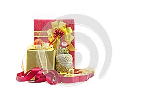 Christmas new year celebration decorations concept - Red and ribbon gold gifts box and decorating elements isolated on white