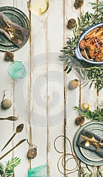 Christmas or New Year celebration table setting over wooden background