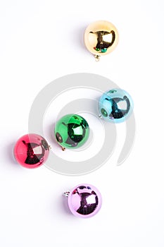 Christmas New Year composition. Gifts, colorful ball decorations on white background. Winter holidays concept