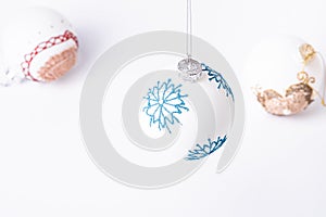 Christmas New Year composition. Gifts, white ball decorations on white background. Winter holidays concept