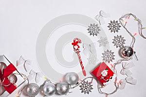 Christmas, New year composition of red and silver decorations, gift box with ribbon bow, balls and snowflakes, flatlay