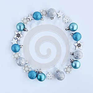 Christmas or new year composition. Round frame made of christmas decoration on white background. Top view