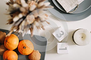 Christmas and New Year composition. tangerines, ginger cookies. festive table setting. Flat lay,  holiday background.
