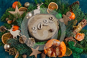 Christmas and New Year compositions on a on a green background 2022 Copy space, flat lay