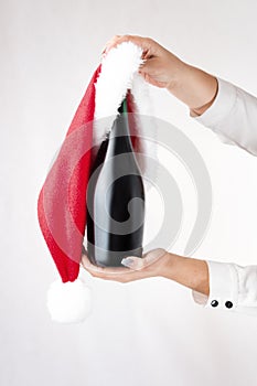Christmas New Year concept bottle champagne in womans hands with