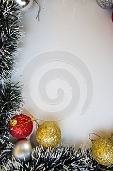 Decorative frame with place for text on white background, greeting cards made from tinsel and christmas balls, Christmas, New Year