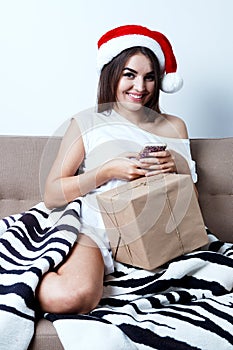 Christmas New Year Concept, model in santa hat with present