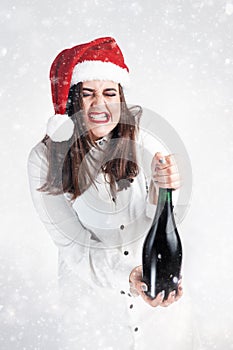 Christmas New Year concept. Model XXL in santa hat with champagne. Fat woman happy. Happy plus size girl hold glass. Big Female i