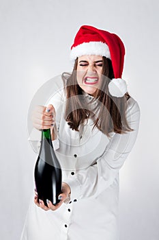 Christmas New Year concept. Model XXL in santa hat with champagne. Fat woman happy. Happy plus size girl hold glass. Big Female i
