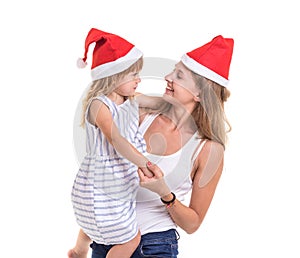 Christmas and New Year concept : Portrait happy mother and daughter were red Christmas hat isolated on white