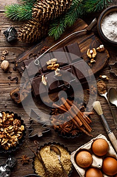 Christmas or new year culinary rustic wooden background with food ingredients for cooking festive dishes, xmas baking. Holiday coo