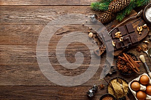 Christmas or new year culinary rustic wooden background with food ingredients for cooking festive dishes, xmas baking. Holiday coo