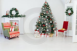 Christmas and New Year decorated interior room. Holiday decorated room with bed on window sill. Festive