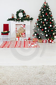 Christmas and New Year decorated interior room. Holiday decorated room with bed on window sill. Festive Xmas