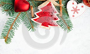 Christmas or New Year decoration background: tree branches, colorful glass balls and glittering stars, top view, copy space