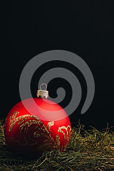 Christmas New Year decoration composition. Top view of fur-tree branches and balls frame on wooden background with place for your