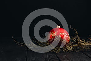 Christmas New Year decoration composition. Top view of fur-tree branches and balls frame on wooden background with place for your