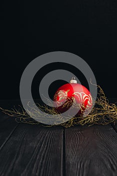 Christmas New Year decoration composition. Top view of fur-tree branches and balls frame on wooden background with place for your