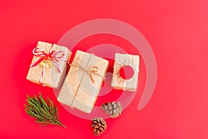 Christmas and New year decorations, Gift box, Pine cones, Pine branch, Golden bell and Red decoration christmas ball on red backgr