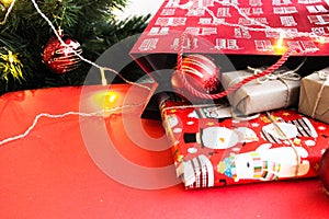 Christmas and New Year decorations mock up or flat lay on red background. Gifts, garland, snowman. Winter, New Years holidays conc