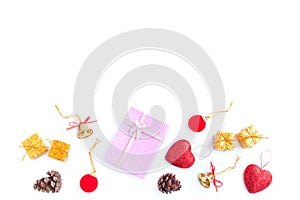 Christmas and New year decorations, Pink gift box, Pine cones, Red glitter heart, Golden bell and Red decoration christmas ball is