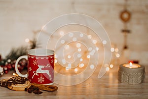 Christmas and new year decorations on wooden desk with lights an