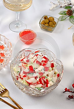 Christmas New Year dishes, detox diet concept, traditional holiday vegetable salad of cucumbers, tomatoes and radishes, healthy