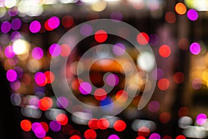 Christmas and New Year festive glitter bokeh background with red, purple and blue colors