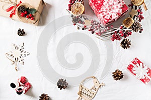 Christmas and new year flat lay decor with wreath and gift box on white backround