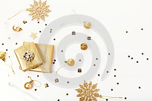 Christmas or new year frame composition. christmas decorations in gold colors on white background with empty copy space