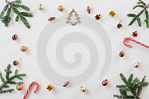 Christmas or new year frame compositions. Christmas decorations and fir branches on white background with copy space for text. the