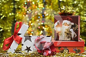 Christmas or New Year gift boxes and ribbons and golden luminous background.