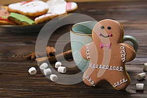 Christmas and New Year Gingerbread man Cookie on wooden table close up