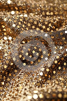 Christmas New Year Gold Glitter background. Holiday abstract texture fabric