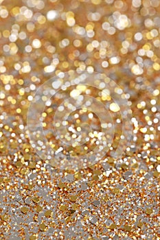 Christmas New Year Gold and Silver Glitter background. Holiday abstract texture