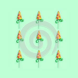 Christmas and New Year greetind card with lollipops shaped like Christmas tree photo