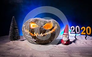 Christmas New Year or Halloween Celebrate Background with Little Christmas Tree on Blurred Bokeh Snow Background with horror