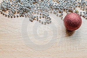 Christmas New Year holiday background. Silver garland and red ball