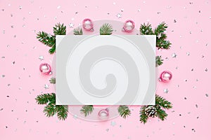 Christmas, New Year holiday card with copy space for text. Blank white paper in frame of natural fir tree branches and