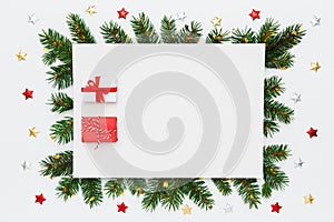Christmas, New Year holiday layout with copy space. Blank white paper with two small Christmas gifts in frame of natural