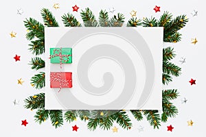 Christmas, New Year holiday layout with copy space. Blank white paper with two small Christmas gifts in frame of natural