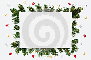Christmas, New Year holiday layout with copy space for text. Blank white paper in frame of natural fir tree branches and