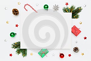 Christmas, New Year holiday layout with copy space for text. Blank white paper, natural fir tree branches and pinecones