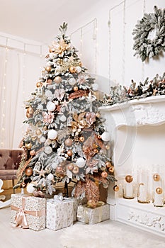 Christmas and New Year holiday. Luxury living room interior design with Xmas tree decorated with white and pink balls