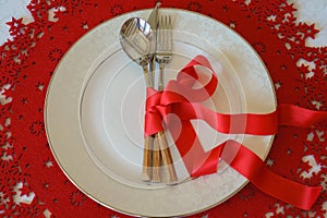 Christmas And New Year Holiday Table Place Setting. Top view, red woolen and white background. Winter holidays concept