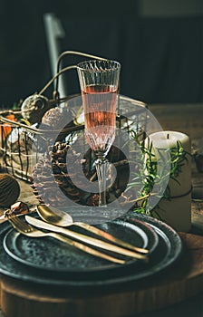 Christmas, New Year holiday table setting with glass of champagne