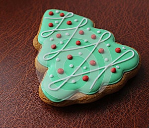 Christmas And New Year Holidays Background With Gingerbread Cookie In Shape Of Pine Tree With Decorative Icing
