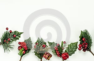 Christmas New Year holidays composition: 5 green branches, red berries and gift