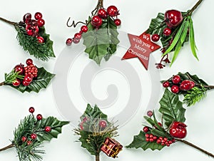 Christmas New Year holidays composition: red star, 8 green holiday branches, red berries and gift