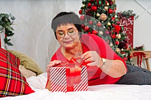 christmas, new year, holidays concept. Happy Woman getting gift box as christmas present. Surprise